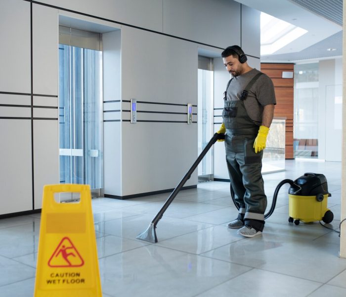 full-shot-man-vacuuming-floor_23-2149345547